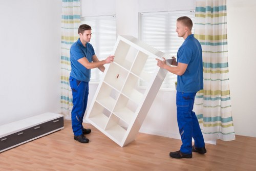 Removal team handling furniture during a man and van move