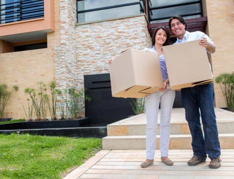 Apartment movers handling furniture during a Clapham Common flat removal